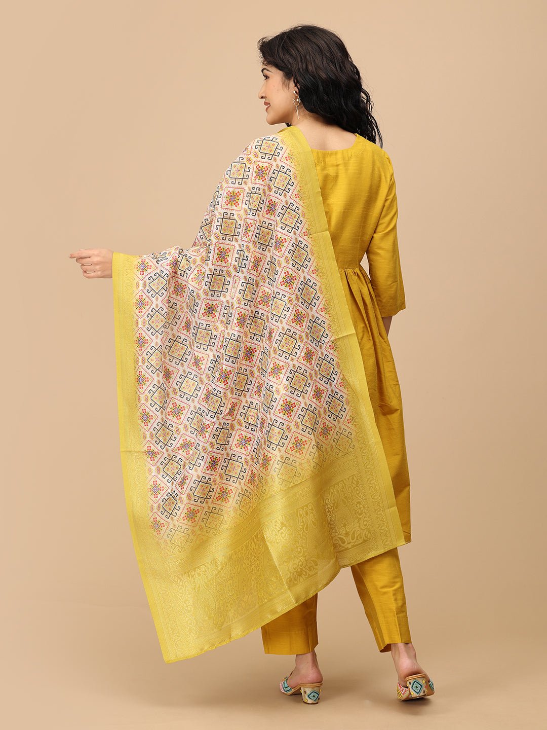 Back view of The Mom Store mustard silk maternity kurta set with yellow printed dupatta.