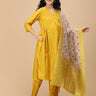 Smiling pregnant woman in The Mom Store mustard maternity silk kurta set showcasing printed dupatta.