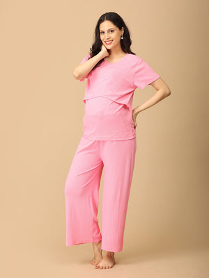 Playful pose by pregnant model wearing Ros√© All Day Maternity and Nursing Nightwear Set from the mom store, touching her face