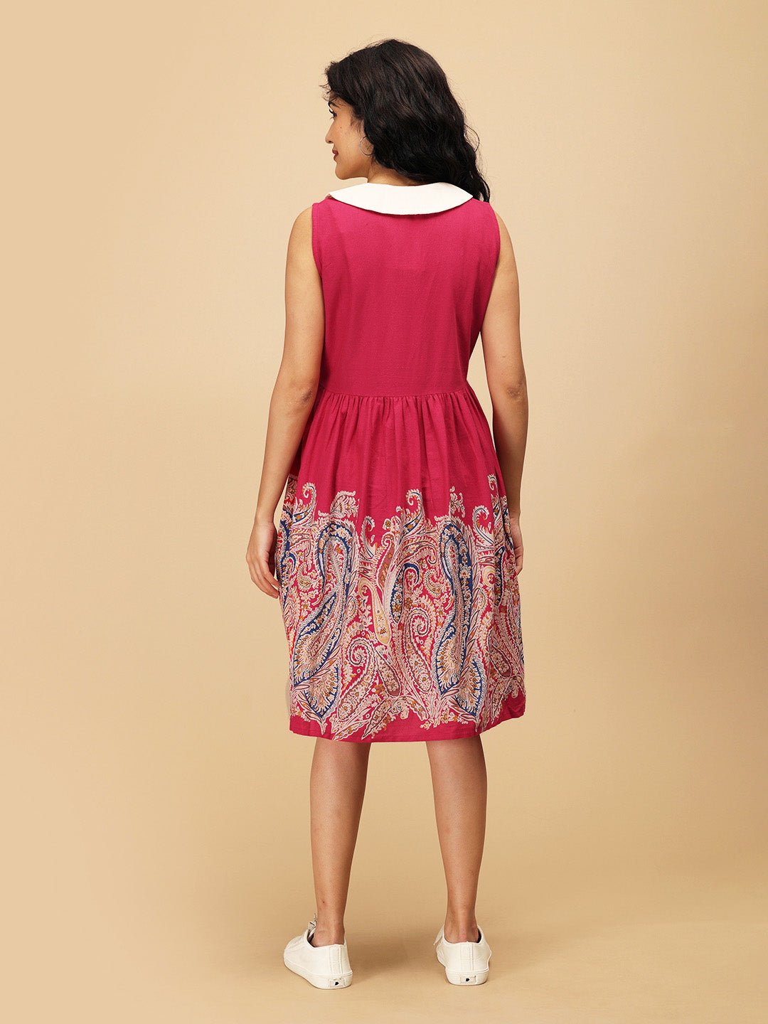 Back view of the Rosé Lane Maternity and Nursing Dress showing sleeveless design, white collar, and paisley border print.