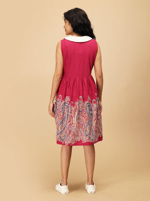Back view of the Ros√© Lane Maternity and Nursing Dress showing sleeveless design, white collar, and paisley border print.