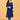 Pregnant model wearing royal blue embroidered maternity silk kurta with light blue pants and white sneakers.