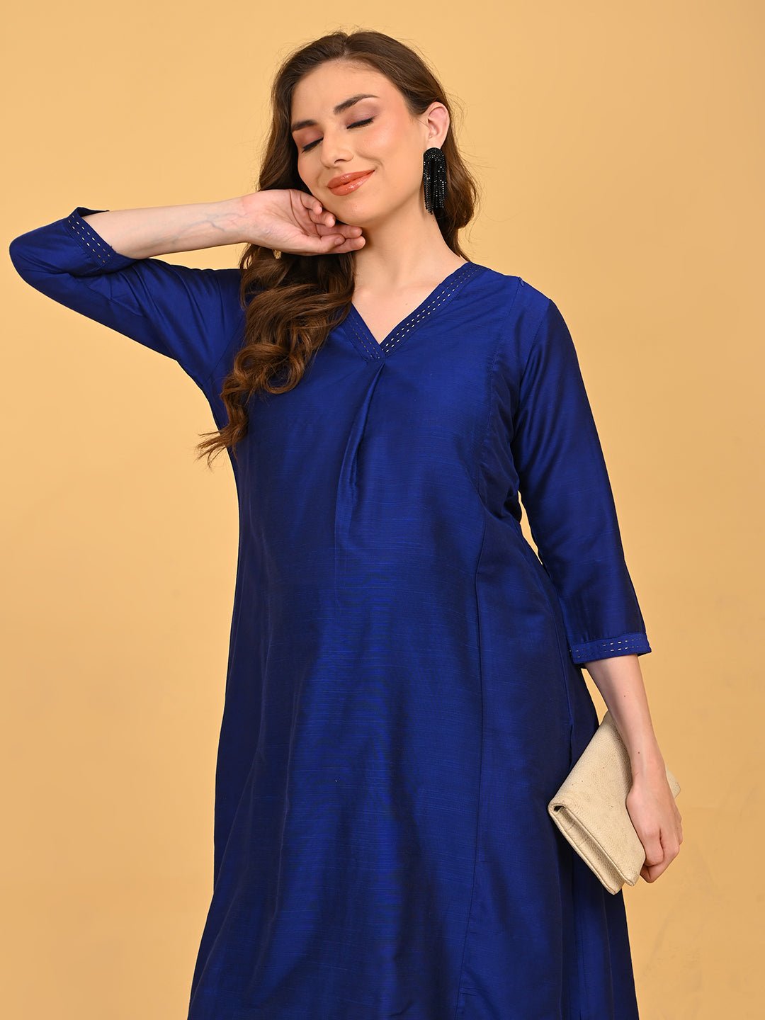Close-up of V-neckline on royal blue maternity kurta with delicate embroidered stitch detailing.