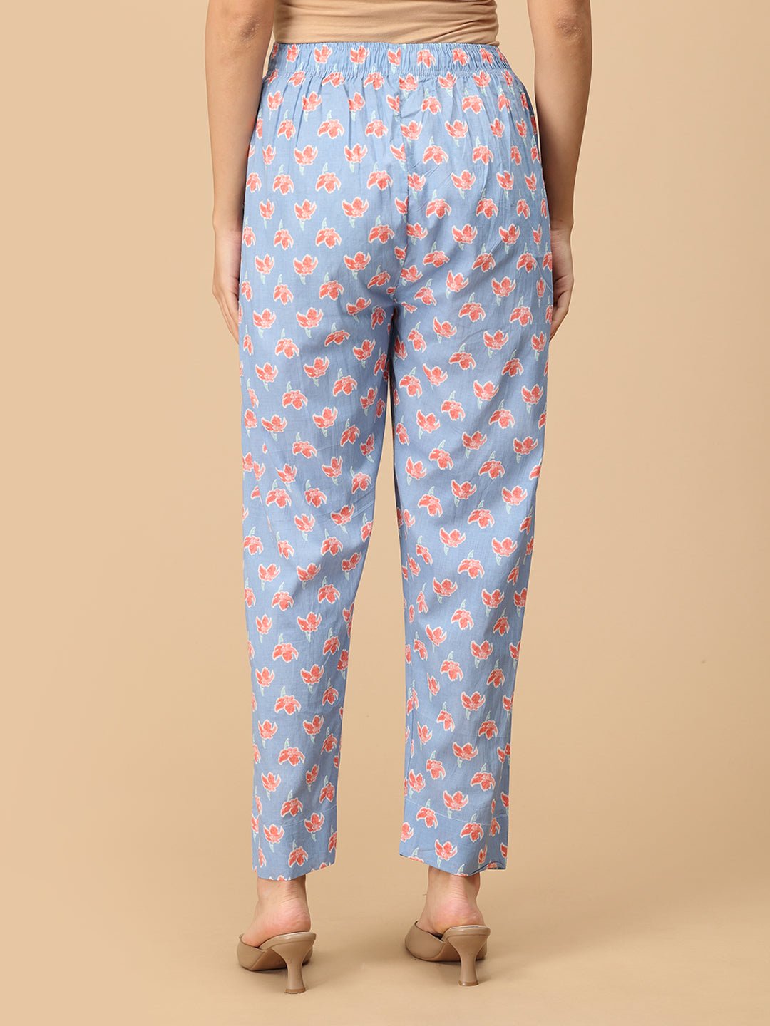 Back view of blue floral maternity pants – soft cotton elastic waist trousers for pregnancy.