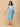 Seafoam Streaks Maternity and Nursing Dress ‚Äì front view of a blue-green printed wrap-style midi dress with short sleeves and pockets.