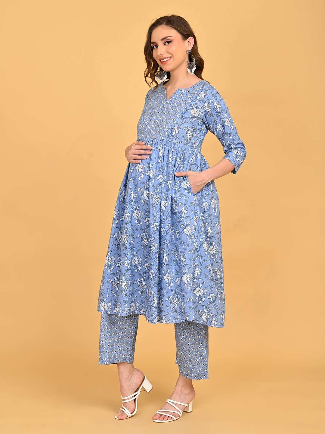 Side view of ShyamAab Maternity and Nursing Kurta Set showing blue floral kurta with three-quarter sleeves and straight-fit pants.