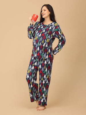 Pregnant model drinking tea wearing Silent Night Maternity Pajama Set from the mom store