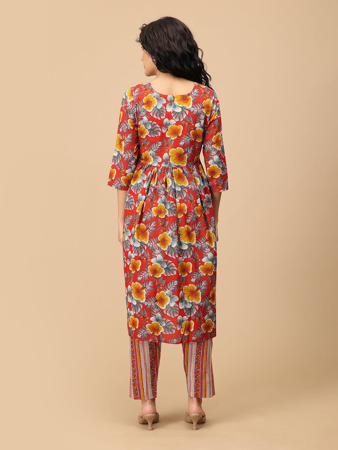 Back view of red floral maternity and nursing kurta paired with striped pregnancy pants