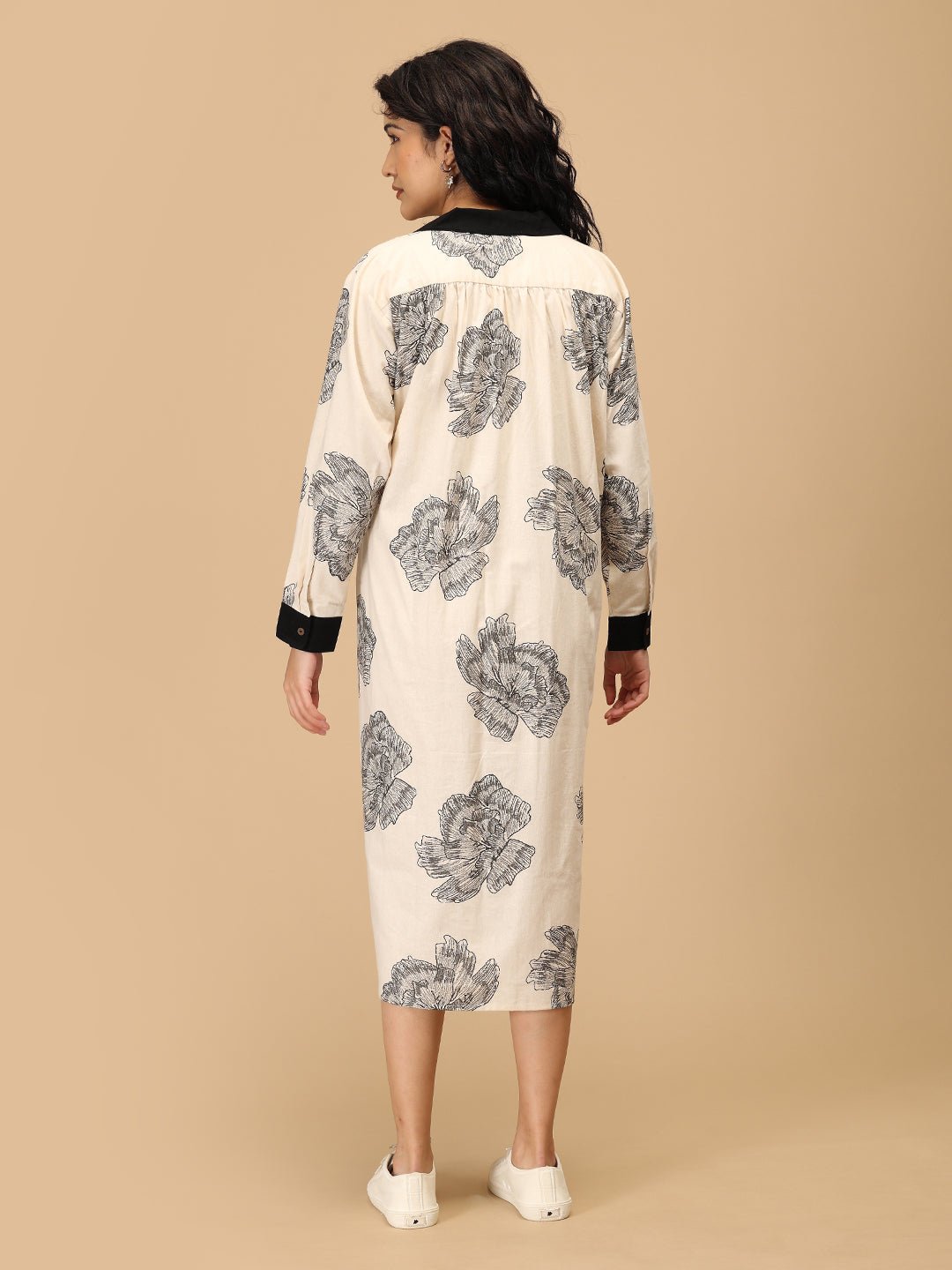 Back view of The Mom Store Sketch Petal maternity dress with sketch floral print and long sleeves.