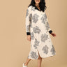 Pregnant woman in The Mom Store Sketch Petal maternity and nursing dress with black floral print.