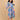 Twirling pose in The Mom Store Sky Bloom maternity and nursing dress with pink floral prints.