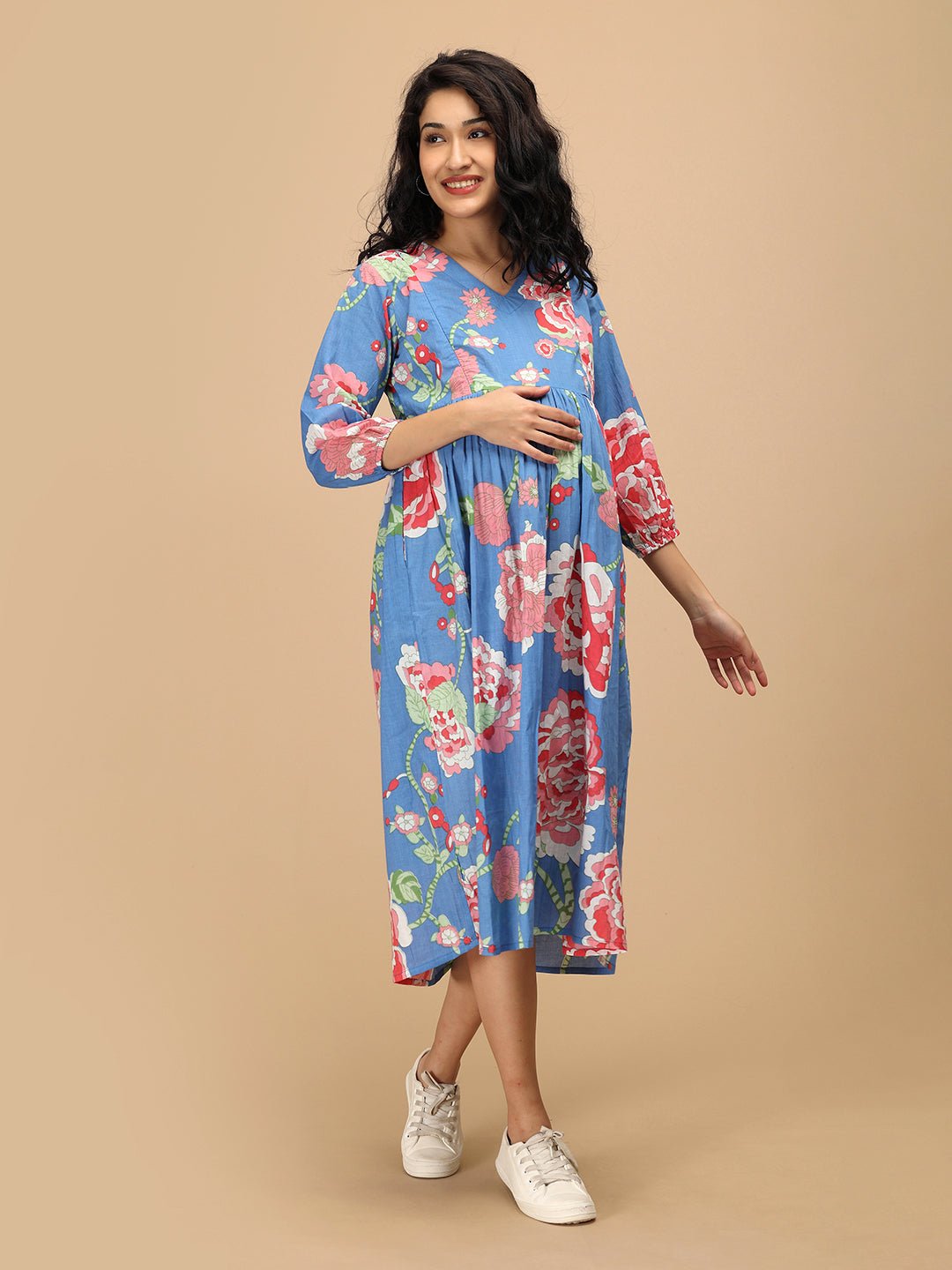 Front view of The Mom Store Sky Bloom maternity dress in blue with large pink floral print.