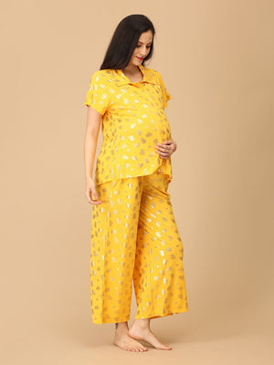 Pregnant model wearing yellow Sparkle Season Maternity and Nursing Nightwear Set from the Mom Store turned sideways