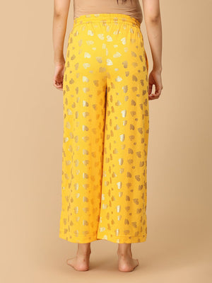 Close up of trousers of Pregnant model wearing yellow Sparkle Season Maternity and Nursing Nightwear Set from the Mom Store