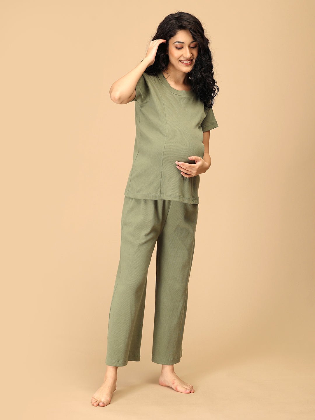 Green maternity nightwear set with comfortable ribbed nursing top and wide-leg pants – lifestyle front pose