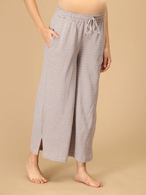 The Mom Store striped maternity pants side view with pockets and ankle slit for relaxed nightwear