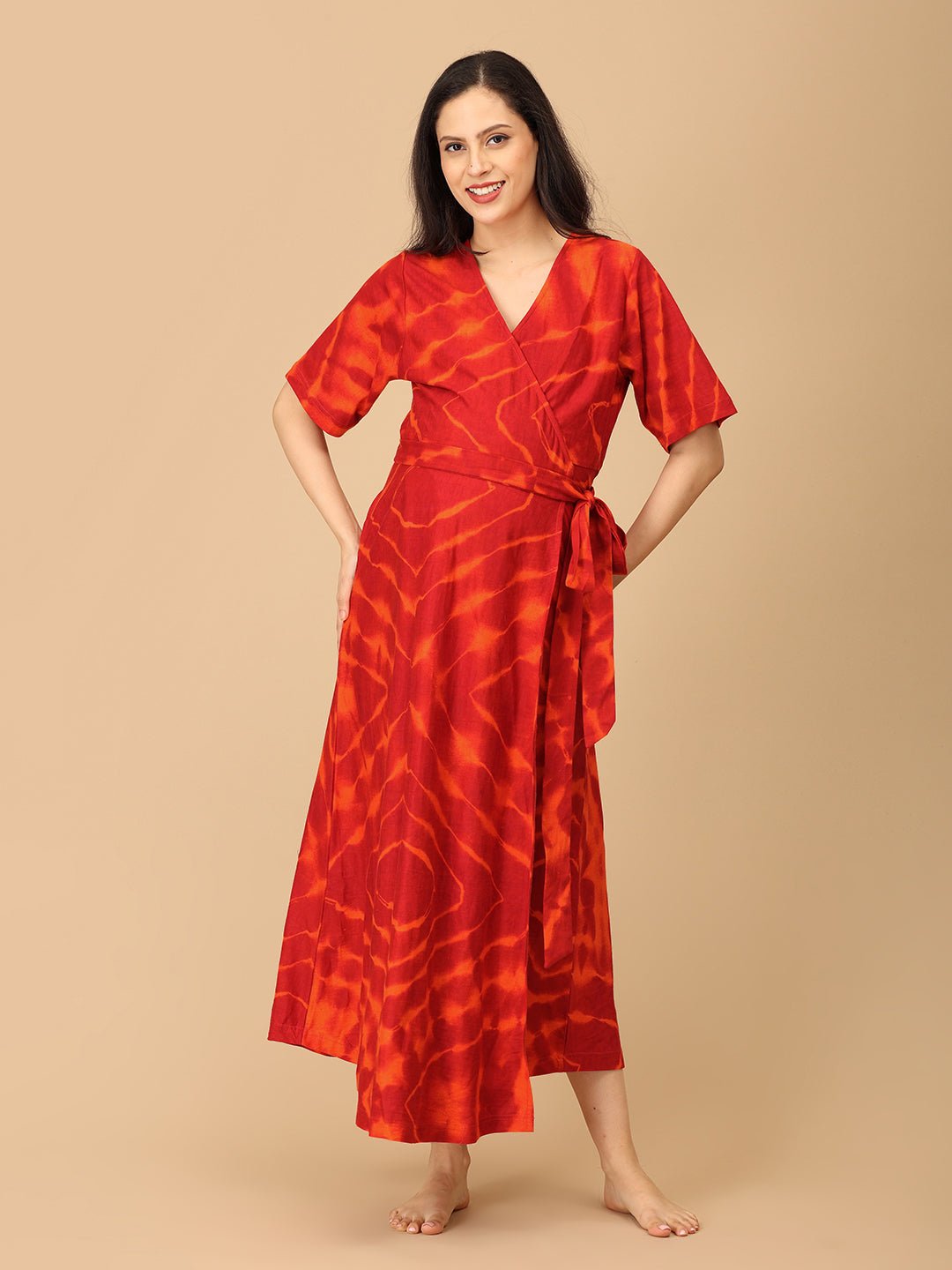 The Mom Store red tie-dye maternity and nursing dress, full front view with flattering silhouette.