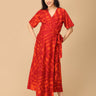 The Mom Store red tie-dye maternity and nursing dress, full front view with flattering silhouette.