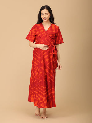 The Mom Store maternity wrap dress in red tie-dye, front view with nursing-friendly neckline.
