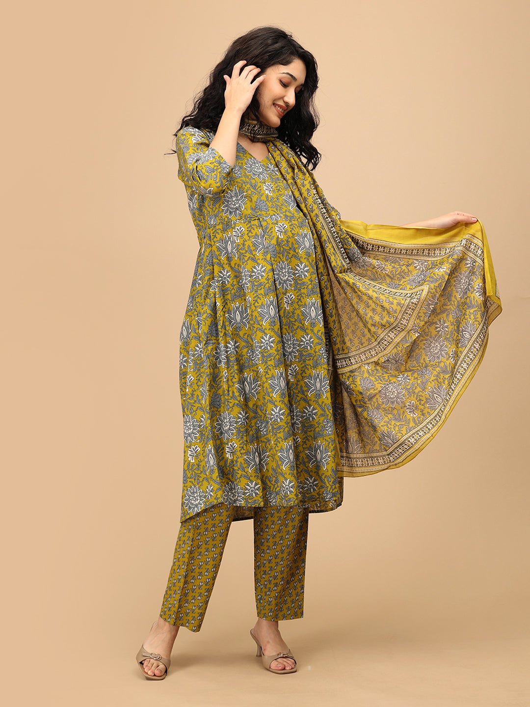 Model showcasing Sunehri Blooms yellow floral maternity kurta and dupatta set – side view with flowy dupatta.”