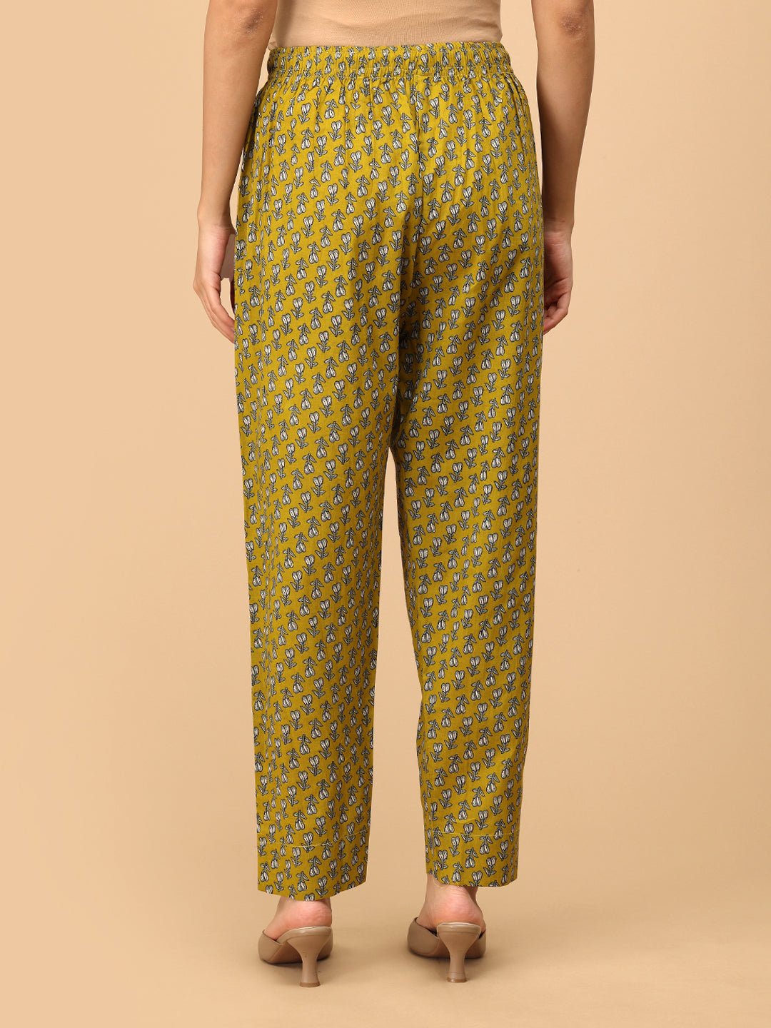 Yellow printed maternity pants – back view of Sunehri Blooms breathable cotton elastic-waist trousers.