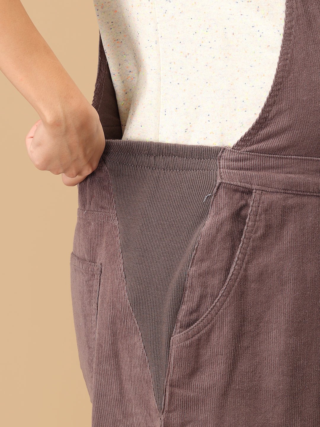 Close-up of stretch side panel on The Mom Store taupe corduroy maternity dungaree for belly comfort.