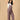 Smiling pregnant woman in The Mom Store taupe corduroy maternity dungaree front view.
