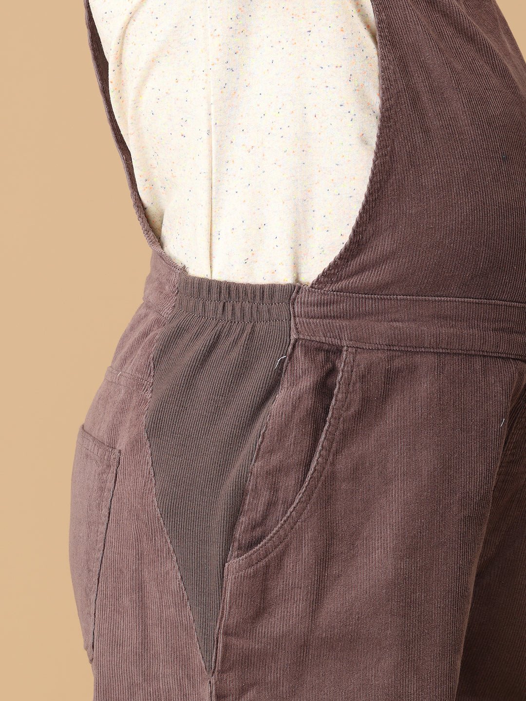 Elastic side panel detail on The Mom Store taupe corduroy maternity dungaree for easy expansion.