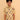 Child wearing a yellow patterned shirt and blue jeans on a beige background