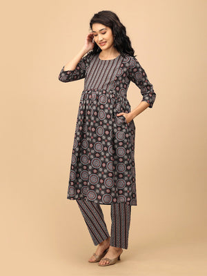 Front pose of the model in The Ajrakh Edit black printed maternity and nursing kurta with matching straight pants.