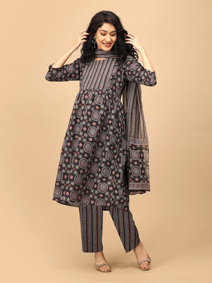 Model wearing The Ajrakh Edit maternity kurta set with dupatta, holding the dupatta while smiling.
