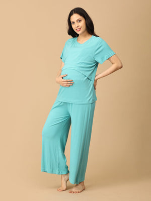 pregnant model wearing Tide Up Together Maternity and Nursing Nightwear Set from the mom store touching her bump and facing to her side