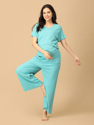 Playful pose by pregnant model wearing Tide Up Together Maternity and Nursing Nightwear Set from the mom store