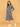 Three-quarter angle view of Undercover Cozy maternity hoodie dress showing curved seam lines and side pockets.