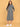 Pregnant model standing comfortably in grey maternity hoodie dress with relaxed knee-length silhouette.