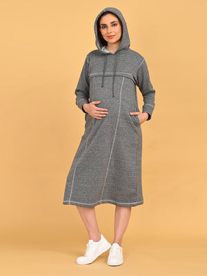 Front view of Undercover Cozy maternity and nursing hoodie dress with hood up and hands in pockets.