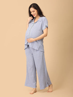 Pregnant model wearing Waffle Cloud Maternity and Nursing Pajama Set from the mom store caressing her belly