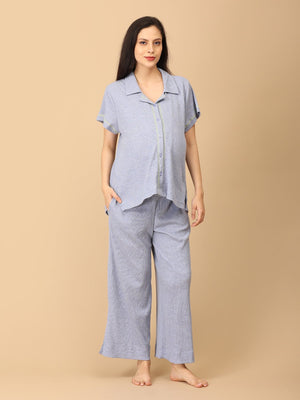 Pregnant model wearing Waffle Cloud Maternity and Nursing Pajama Set from the mom store with her hands in pocket
