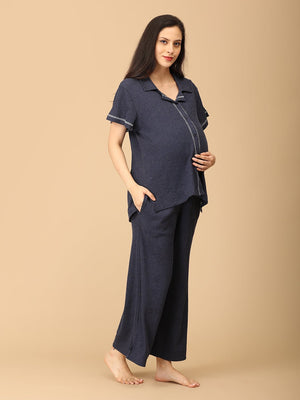 Close up of a Pregnant lady wearing Waffle Walks Maternity and Nursing Pajama Set from the mom store touching her belly and a hand in pocket