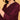Close-up of three-quarter sleeve on wine maternity kurta with embroidered cuff accents.