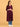 Three-quarter view of wine maternity kurta highlighting bump-friendly A-line silhouette.