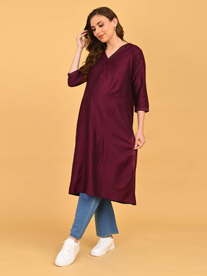 Side view of pregnant model in wine silk maternity kurta showing relaxed fit and side slit detail.
