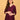 Upper body view of model wearing wine embroidered maternity silk kurta with V-neck and soft sheen fabric.