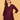 Upper body view of model wearing wine embroidered maternity silk kurta with V-neck and soft sheen fabric.