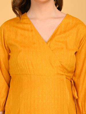 Close up of V-neck design of yellow go go maternity wrap dress