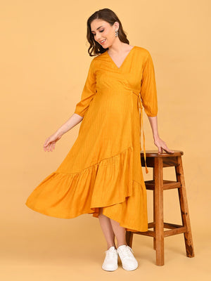 playful pose with model in yellow go go maternity wrap dress